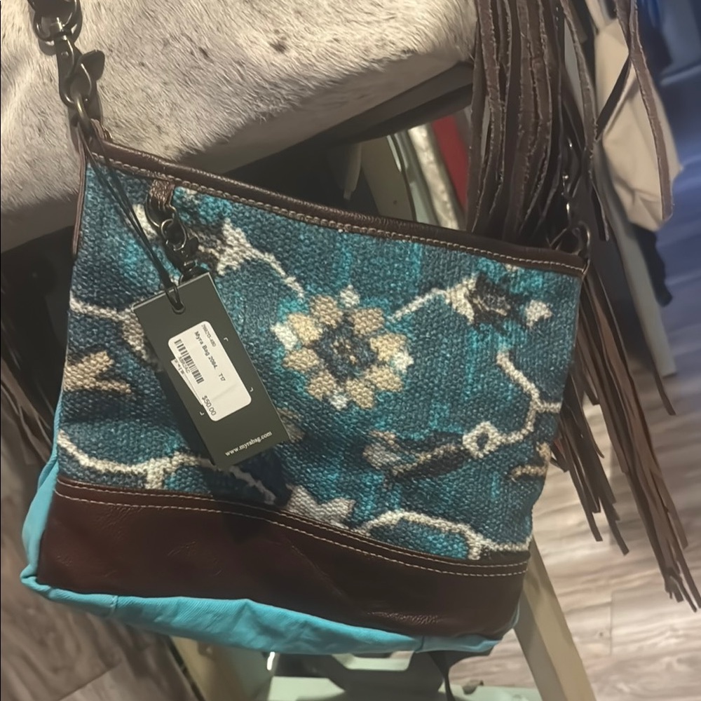 Western style clutches and crossbody made with canvas and leather